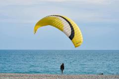 Photo by Engin Akyurt on <a href="https://www.pexels.com/photo/person-with-yellow-and-white-gliding-parachute-near-sea-2232707/">Pexels.com</a>